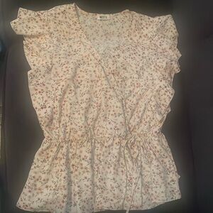 Large West K cross over shirt.